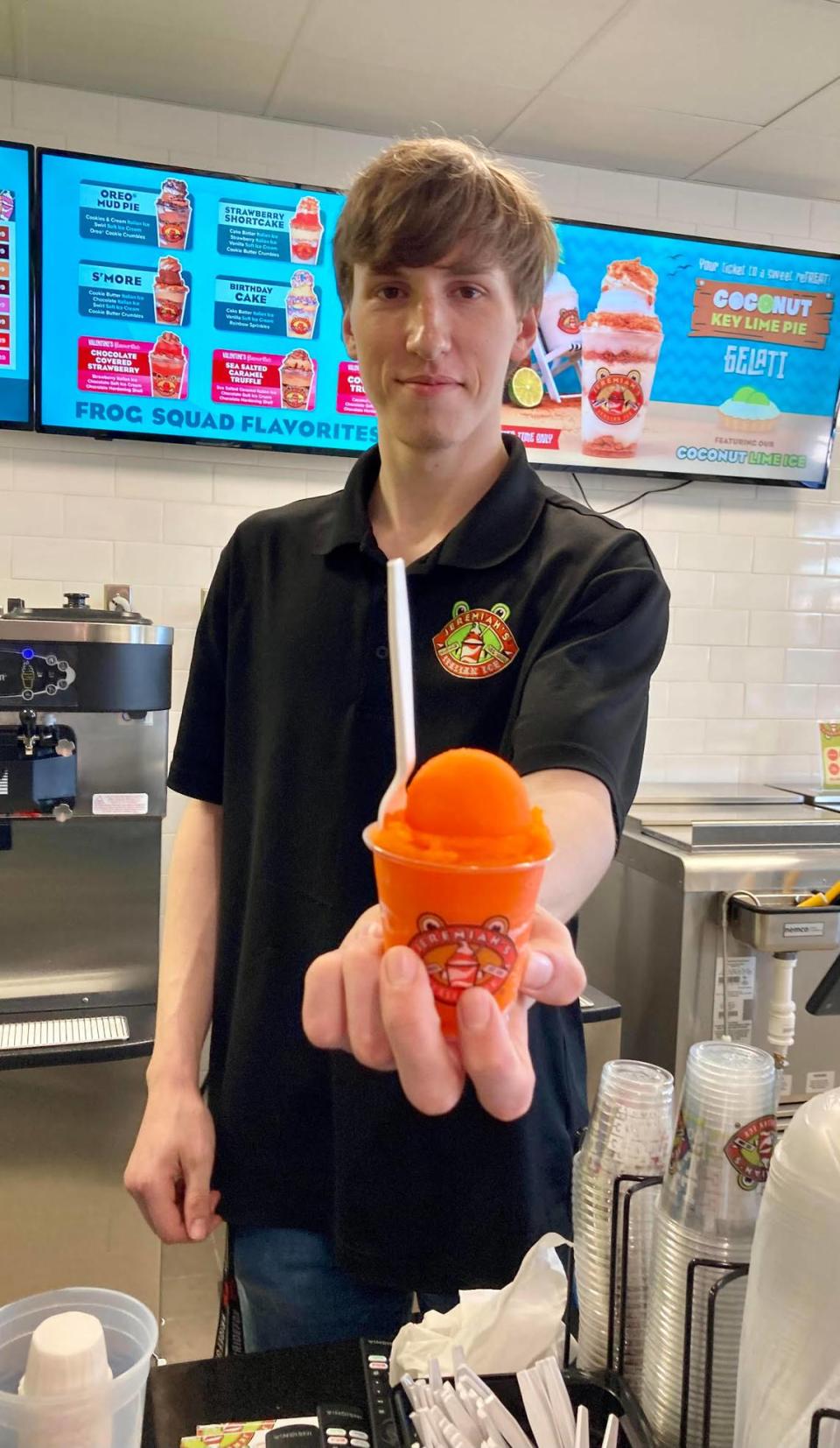 Grant Ledford of Jeremiah’s Italian Ice serves up a sugar-free tangerine Italian ice.