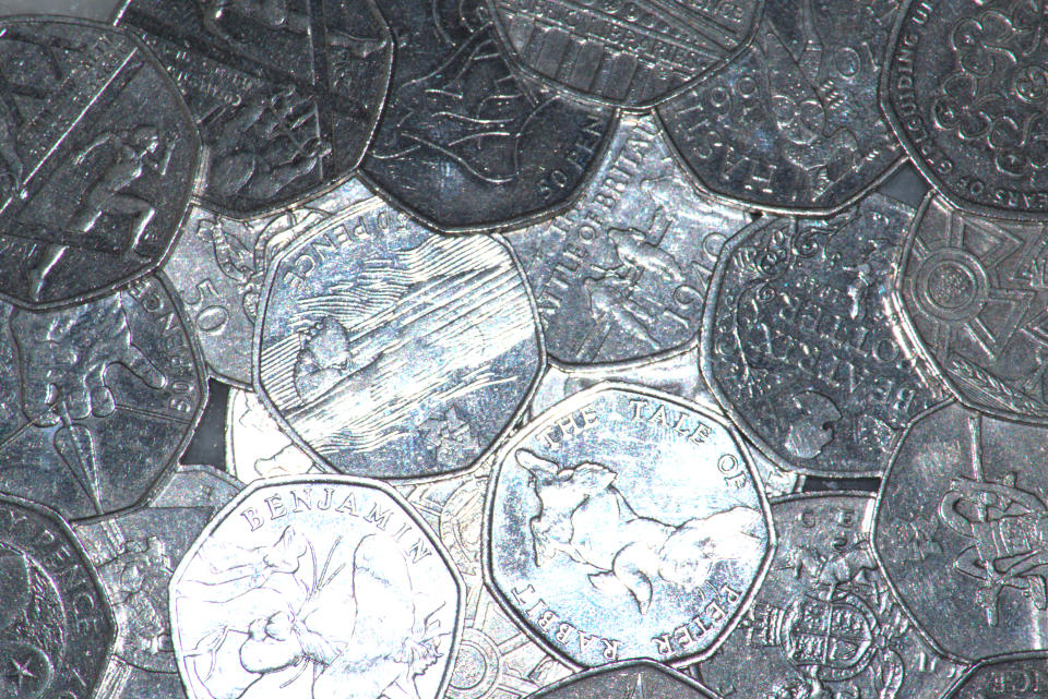 Image of the reverse view of a number of commemorative UK fifty pence coins.