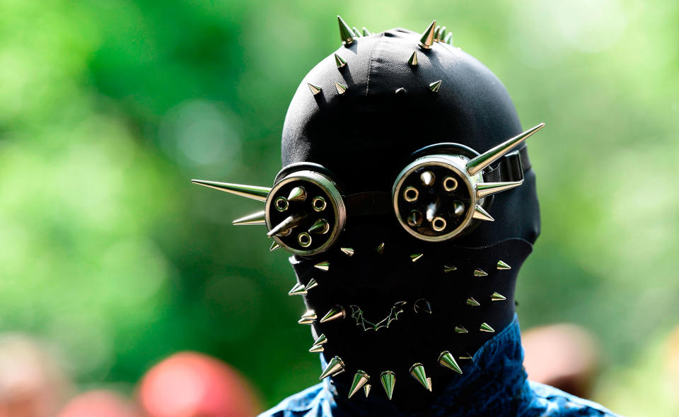 A masked participant attends the picnic