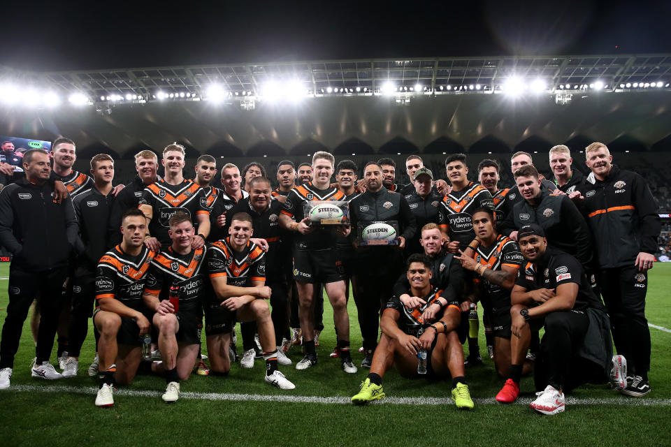 Chris Lawrence and Benji Marshall pose with team mates after playing their last game for the Tigers.