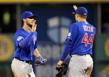 Chicago Cubs third baseman Kris Bryant (L) and first baseman Anthony Rizzo (44) celebrate after defeating the Pittsburgh Pirates in twelve innings at PNC Park. Charles LeClaire-USA TODAY Sports