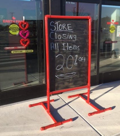A sign outside Earth Fare's Saint Johns location advertises the store's liquidation sale. The store plans to close by mid-February just months after reopening.