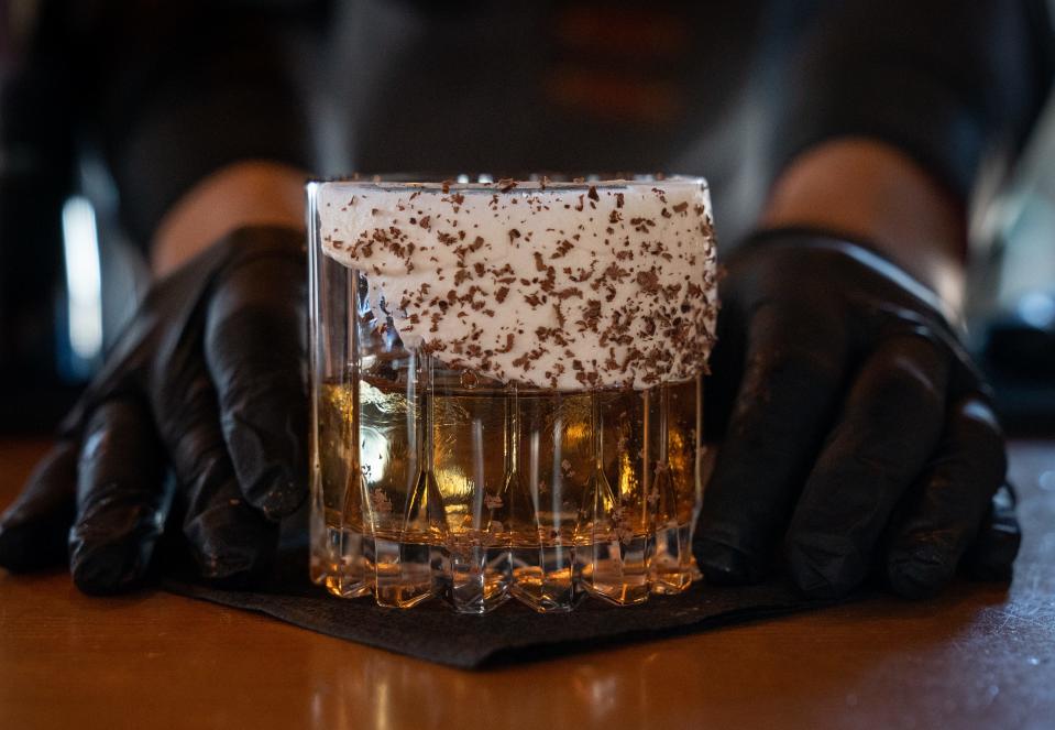 Fernando Acuna prepares a Ole Smoky cookie dough, April 4, 2024, at Dahlia Tapas Tequila & Wine on 2221 N. Seventh Street in Phoenix.