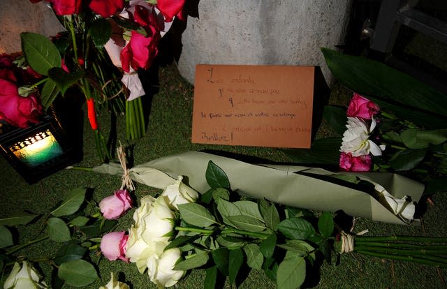 Flowers and teddy bears left at the children’s play area 