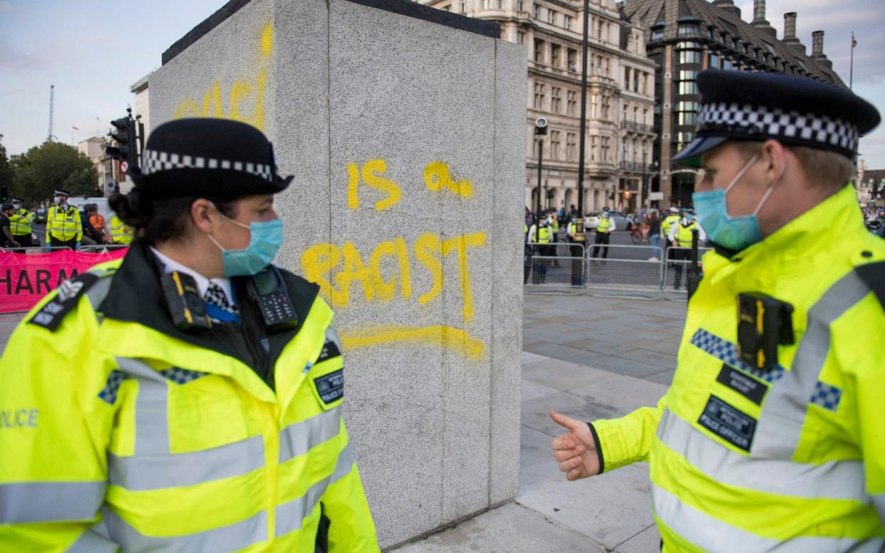 Despite hundreds of officers on duty in Westminster, a demonstrator was able to write "was a racist" at the foot of Winston Churchill's statue - Ben Cawthra/LNP 