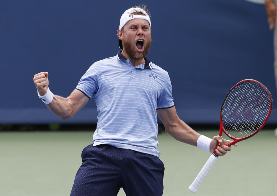 Radu Albot, of Moldova, reacts to winning his match against Marin Cilic, of Croatia, during first round play at the Western & Southern Open tennis tournament, Monday, Aug. 12, 2019, in Mason, Ohio. (AP Photo/Gary Landers)