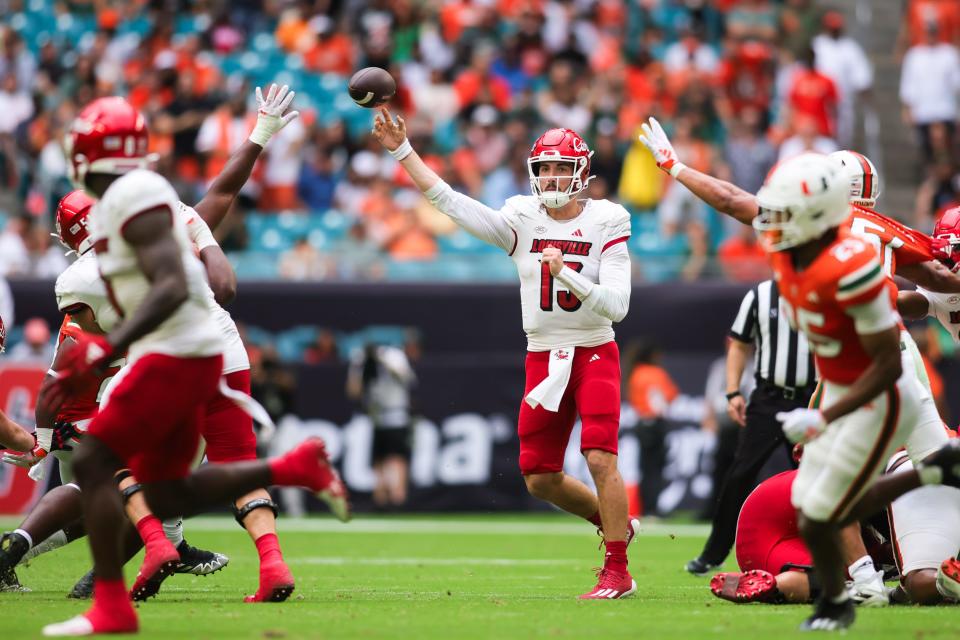 Louisville quarterback Jack Plummer looks for a receiver in the second quarter against Miami. Plummer passed for 308 yards in the 38-31 road victory Saturday.