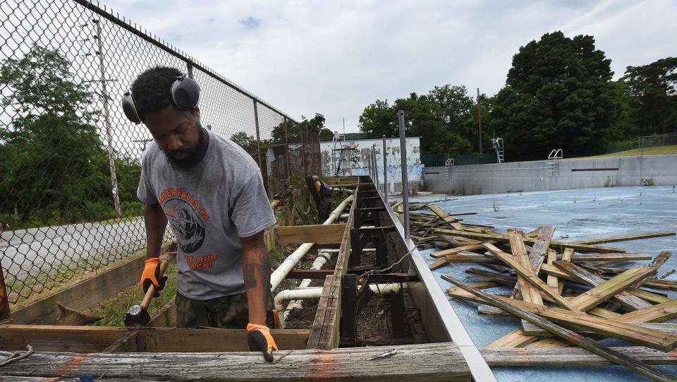 Tyrone Zeigler works on removing the old deck from the Tigerland Wave Pool in 2020.