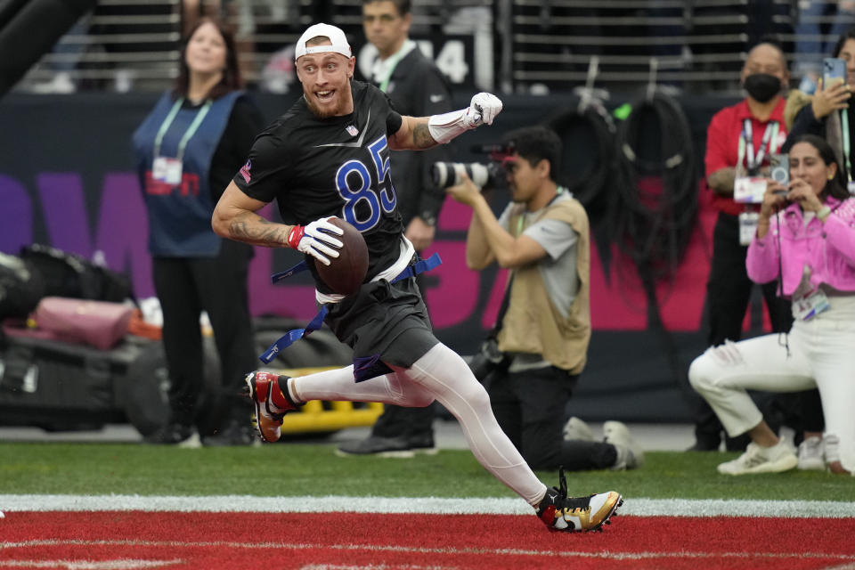 NFC tight end George Kittle (85) of the San Francisco 49ers scores a touchdown during the flag football event at the NFL Pro Bowl against the AFC, Sunday, Feb. 5, 2023, in Las Vegas. (AP Photo/John Locher)