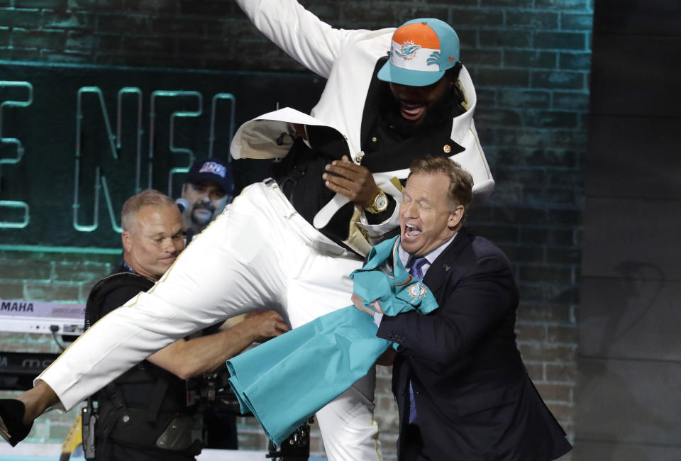 In 2020, we won't see scenes like when Clemson defensive tackle Christian Wilkins gave an uncoordinated shoulder bump with NFL commissioner Roger Goodell. (AP Photo/Steve Helber, File)