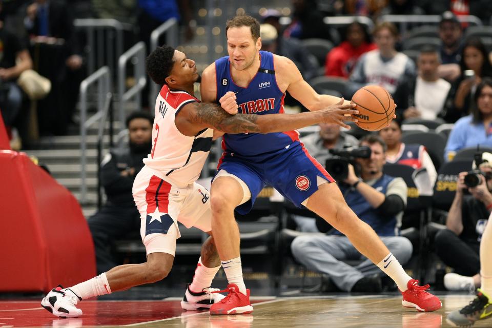 Wizards guard Bradley Beal reaches for the ball against Pistons forward Bojan Bogdanovic, right, during the first half on Tuesday, Oct. 25, 2022, in Washington.