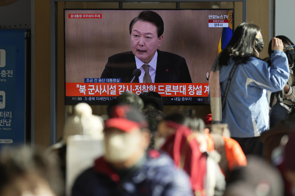 A TV screen shows a news program reporting about South Korean President Yoon Suk Yeol speaking during a cabinet council meeting, at the Seoul Railway Station in Seoul, South Korea, Tuesday, Dec. 27, 2022. President Yoon on Tuesday called for a stronger air defense and high-tech stealth drones to better monitor North Korea, a day after it accused five North Korea of flying drones across the rivals’ tense border for the first time in five years. (AP Photo/Lee Jin-man)