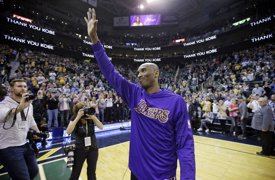 Los Angeles Lakers forward Kobe Bryant waves to the fans after his introduction before the start of the first quarter of an NBA basketball game against the Utah Jazz Monday, March 28, 2016, in Salt Lake City. (AP Photo/Rick Bowmer)