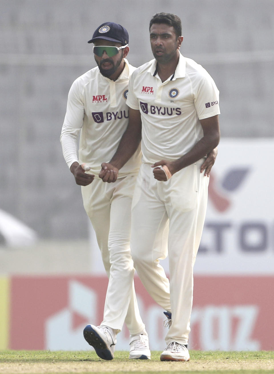 India's Ravichandran Ashwin, right, and Captain K.L. Rahul celebrates the wicket of Bangladesh's Najmul Hossain Shanto on the day one of the second test cricket match Bangladesh between India, in Dhaka, Bangladesh, Thursday, Dec. 22, 2022. (AP Photo/Surjeet Yadav)