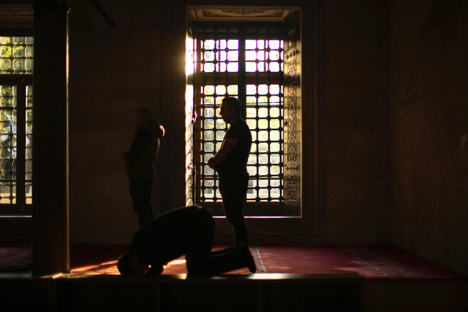 Muslims worshippers pray at Suleymaniye mosque in Istanbul, Turkey, Friday, Oct. 28, 2022. Turkish President Recep Tayyip Erdogan on Friday laid out his vision for Turkey in the next century, promising a new constitution that would guarantee the rights and freedoms of citizens. (AP Photo/Francisco Seco)