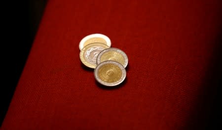 Argentine coins of 1 and 2 pesos are pictured in Buenos Aires