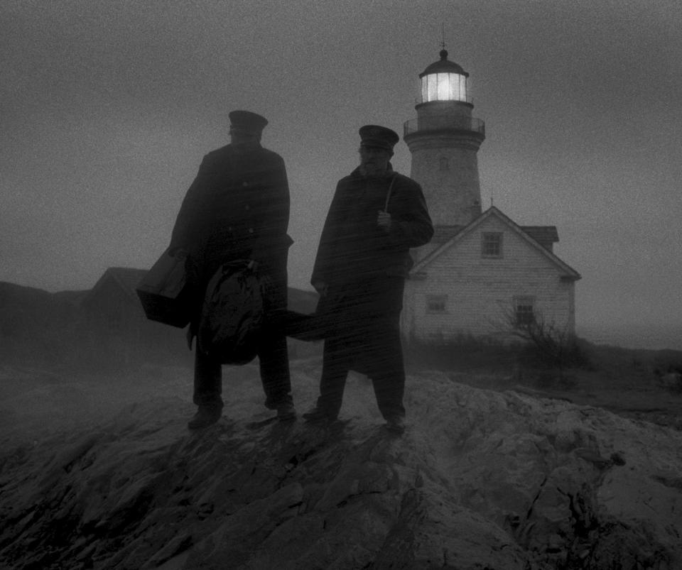 This image released by A24 Films shows Willem Dafoe, right, and Robert Pattinson in a scene from "The Lighthouse." (A24 Pictures via AP)