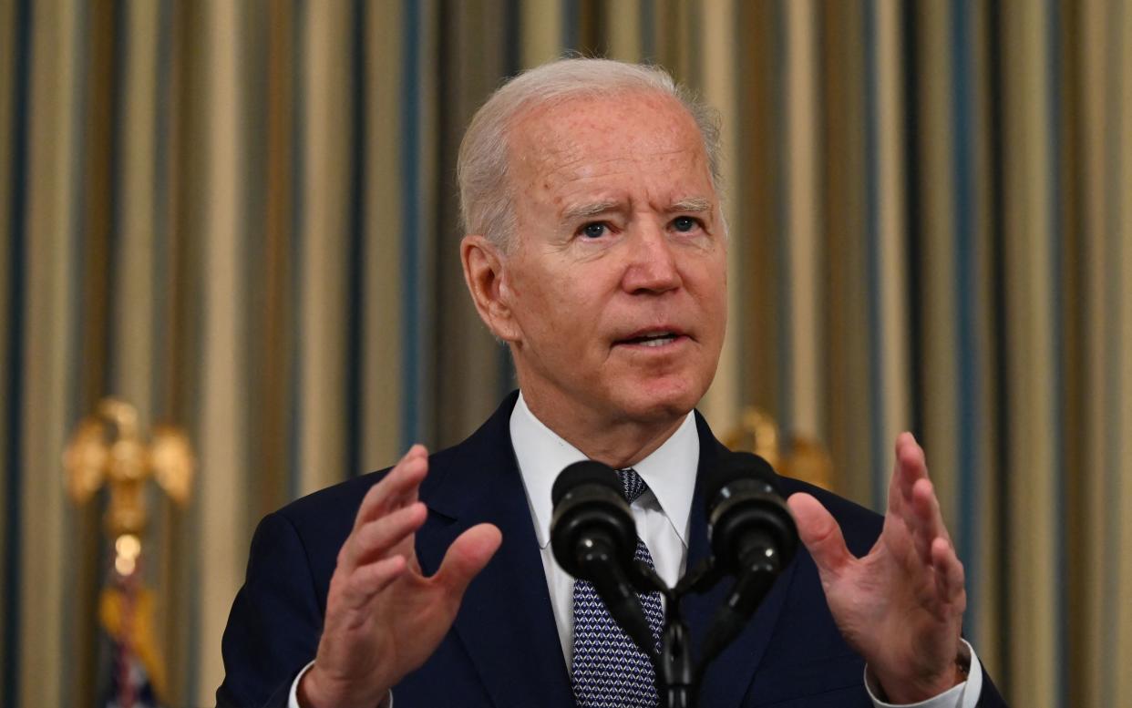 President Biden delivers remarks at the White House on Friday. 