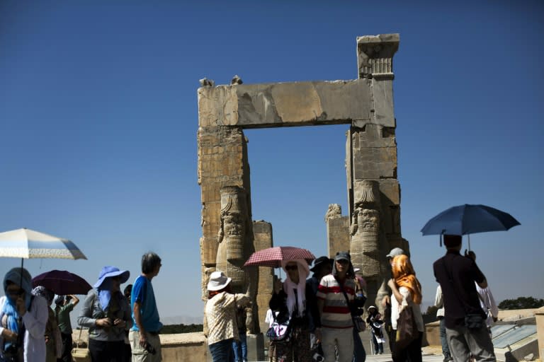 Tourists from Hong Kong visit the "Gate of All Nations" at the ancient Persian city of Persepolis in southern Iran