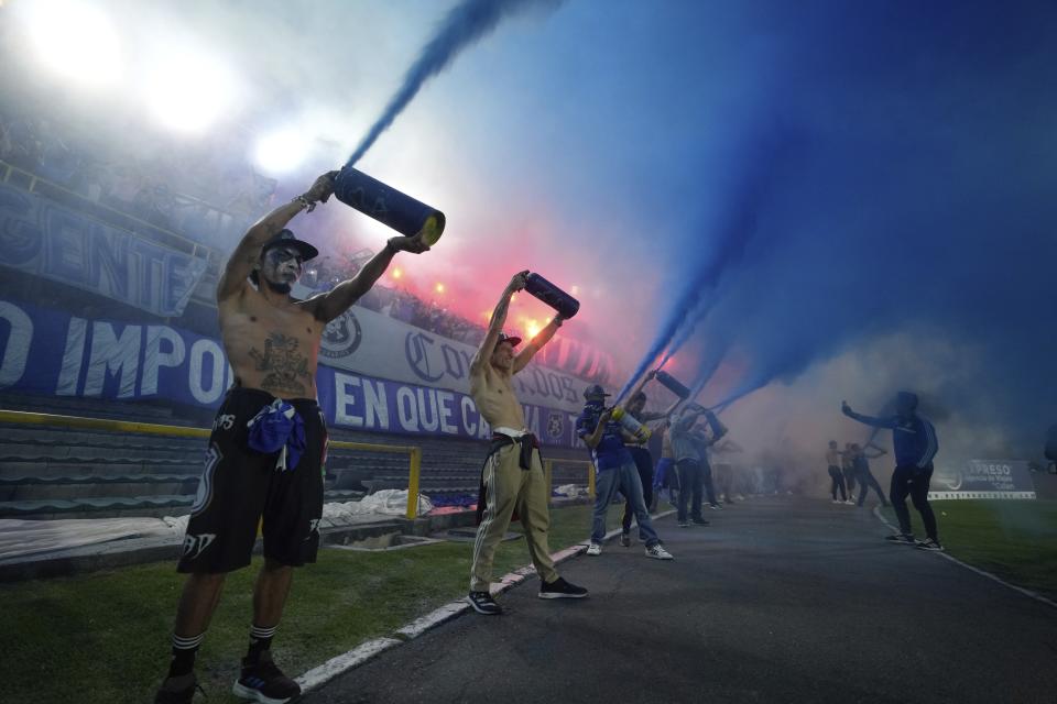 Millonarios soccer fans get revved up prior to the start of the Colombian championship title match against Atletico Nacional, at El Campin stadium in Bogota, Colombia, Saturday, June 24, 2023. (AP Photo/Fernando Vergara)