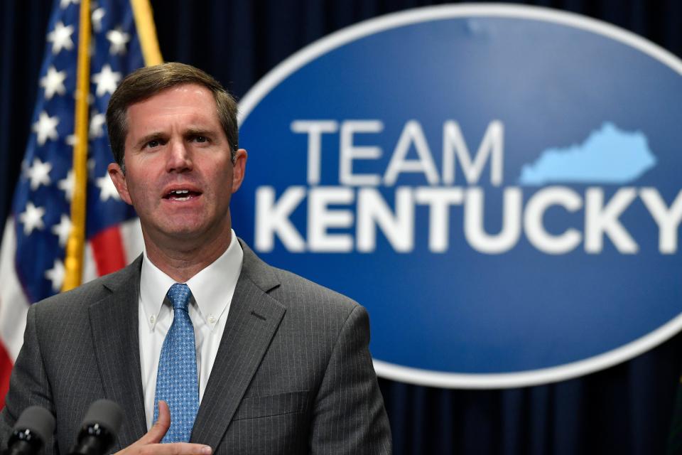 Kentucky Governor Andy Beshear addresses reporters during a press conference where he announced an executive order stating that starting next year, Kentuckians with certain severe medical conditions and who meet specific requirements will be able to possess and use small amounts of legally purchased medical cannabis to treat their medical conditions in Frankfort, Ky., Tuesday, Nov. 15, 2022. (AP Photo/Timothy D. Easley)