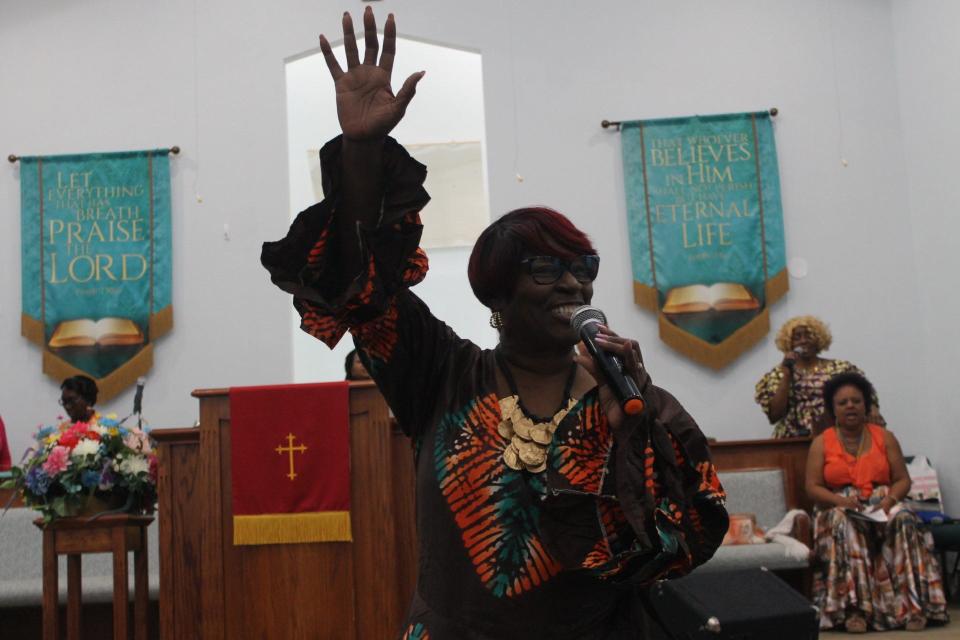 The Rev. Dr. Marie Herring, pastor of DaySpring Baptist Church, praise the lord during a service celebrating the 109th anniversary of the church located at 1945 NE Eighth Ave.
(Credit: Photo by Voleer Thomas, Correspondent)