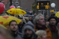 Thousand of demonstrators pass a sign urging people to respect the 1.5 meter coronavirus security measure as they march in Utrecht, Netherlands, Saturday, Dec. 4, 2021, to protest against COVID-19 restrictions and the lockdown. (AP Photo/Peter Dejong)