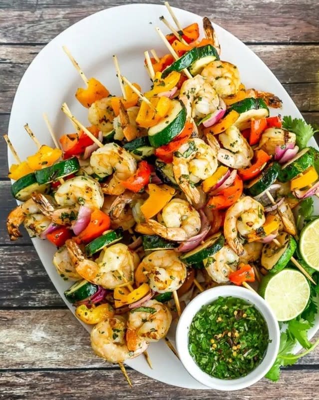 <p>The delicious sauce doubles as a marinade, giving these shrimp skewers lots of flavor without any fuss. A great healthier option for backyard grilling! <strong>Get the Recipe: <a href="https://www.babaganosh.org/grilled-shrimp-vegetable-skewers/" rel="nofollow noopener" target="_blank" data-ylk="slk:Grilled Shrimp and Vegetable Skewers;elm:context_link;itc:0;sec:content-canvas" class="link ">Grilled Shrimp and Vegetable Skewers</a></strong></p>