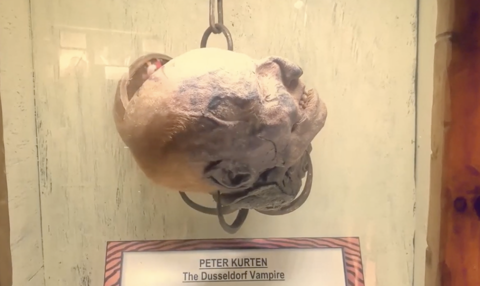 A preserved head labeled "Peter Kurten - The Dusseldorf Vampire" on display