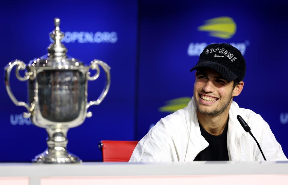 Carlos Alcaraz beams after securing his first major trophy (Getty Images)