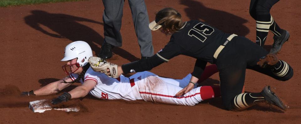 Indiana's Grayson Radcliffe (26) is tagged out on the attempted steal at second base by Purdue's Rachel Becker (15) during the Indiana Purdue softball game at Andy Mohr Field in Bloomington, Ind. Wednesday, April 10, 2019. (Chris Howell/Herald-Times)