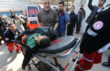 A wounded Palestinian is brought into a hospital following what police said was an Israeli air strike in Rafah in the southern Gaza Strip February 27, 2017. REUTERS/Ibraheem Abu Mustafa