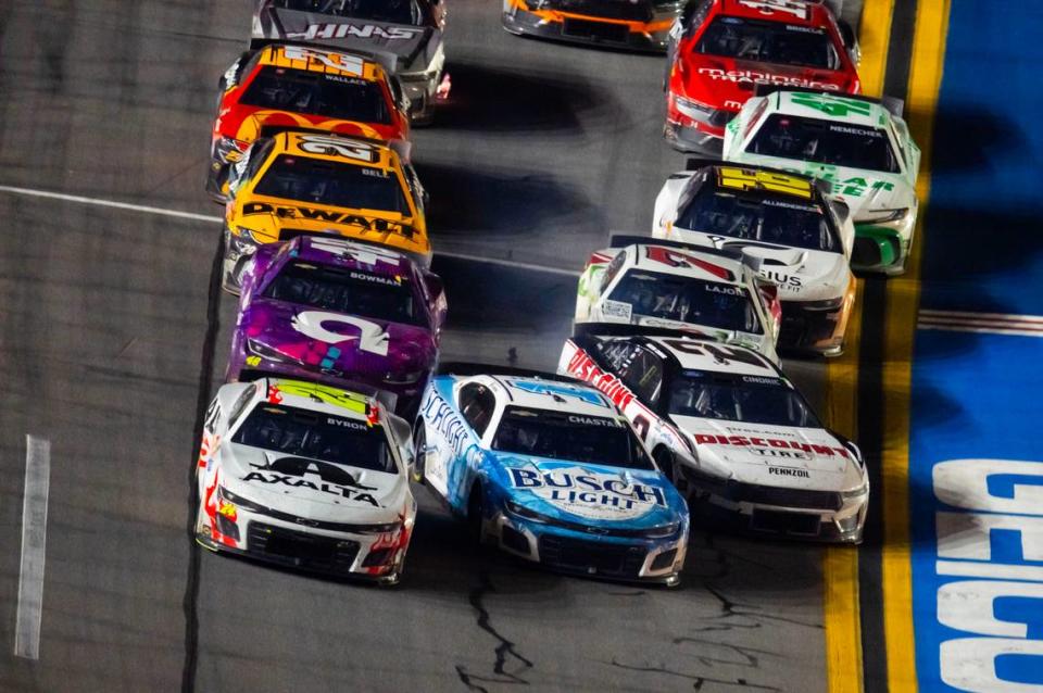 Feb 19, 2024; Daytona Beach, Florida, USA; NASCAR Cup Series driver William Byron (24) leads the field as Ross Chasten (1) and Austin Cindric (2) crash coming to the white flag during the Daytona 500 at Daytona International Speedway. Mark J. Rebilas/USA TODAY Sports