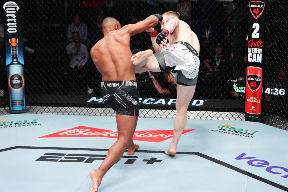 LAS VEGAS, NEVADA – APRIL 06: (R-L) Dylan Budka and Cesar Almeida of Brazil trade strikes in a middleweight fight during the UFC Fight Night event at UFC APEX on April 06, 2024 in Las Vegas, Nevada. (Photo by Jeff Bottari/Zuffa LLC via Getty Images)