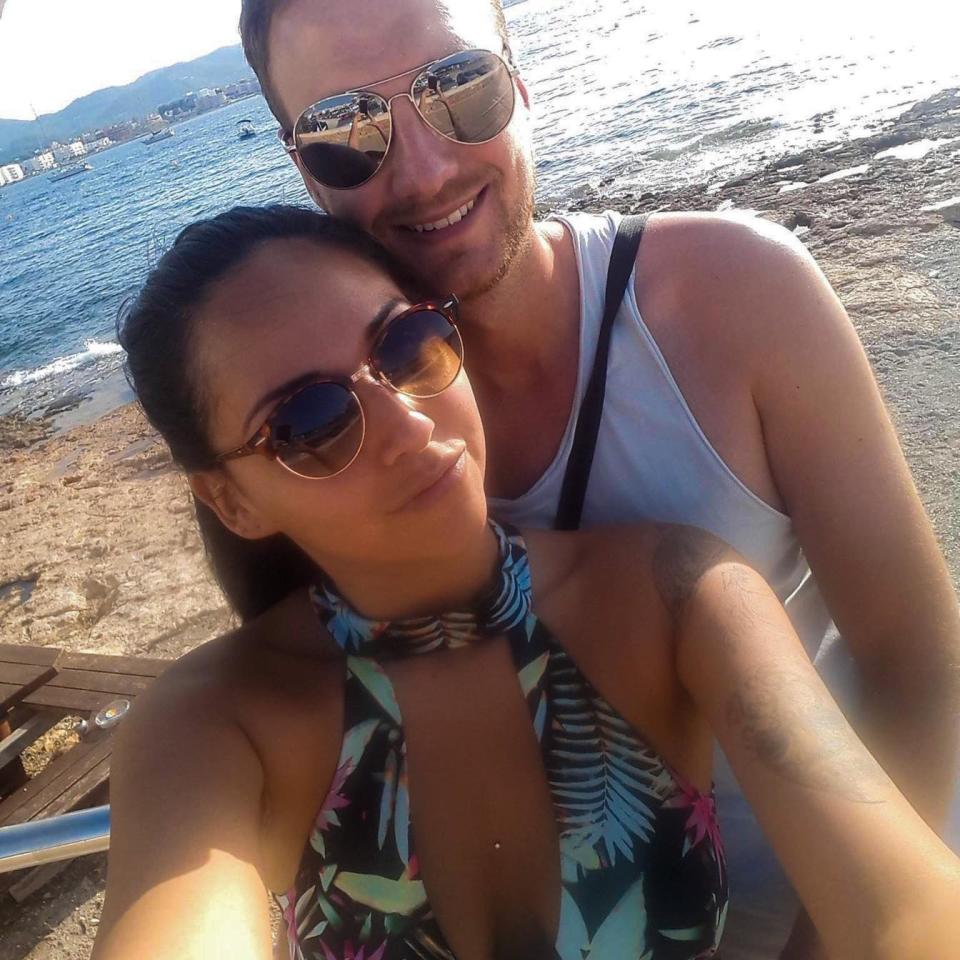 Maria Shaw takes a selfie of her and her partner on a beach on a sunny day. Source: Facebook