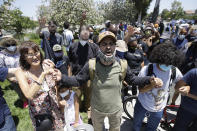 Demonstrators pray Thursday June, 4, 2020 in Santa Clarita, Calif., during a protest over the death of George Floyd who died May 25 after he was restrained by Minneapolis police. (AP Photo/Marcio Jose Sanchez)