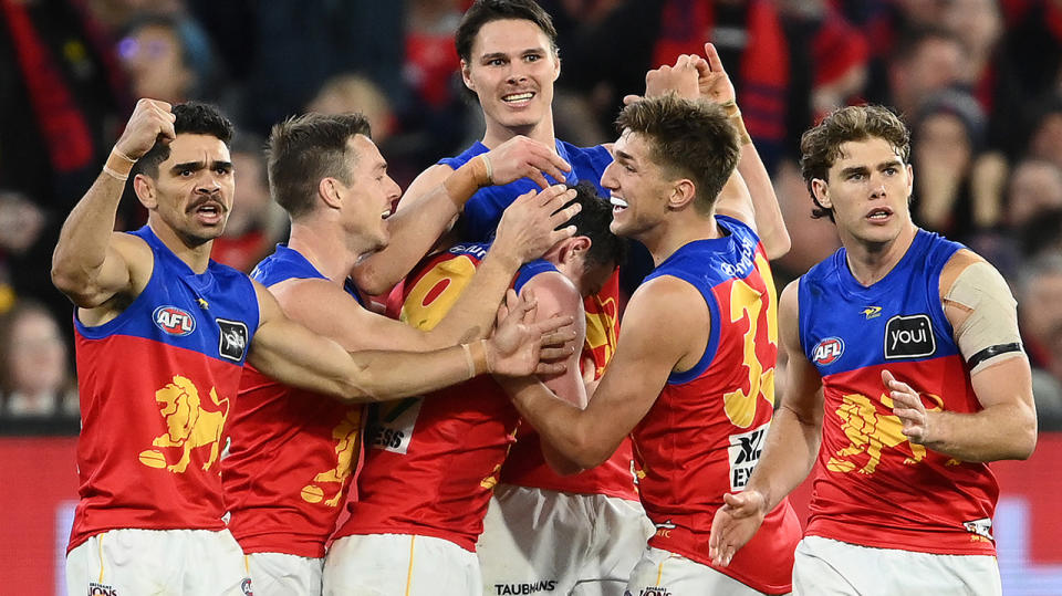 Brisbane Lions players celebrate a goal in their semi-final win against Melbourne.