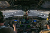 In this handout photo from the U.S. Air Force, pilots from the 340th Expeditionary Air Refueling Squadron land a U.S. Air Force KC-135 Stratotanker at Al-Udeid Air Base, Qatar, Nov. 16, 2022. As over a million World Cup fans fill stadiums with cheers and carry heady optimism through the streets of Doha, some 8,000 American troops are running air wars in Afghanistan, Iraq, Syria and other hotspots in the Middle East mere miles away. (U.S. Air Force/Staff Sgt. Kirby Turbak, via AP)