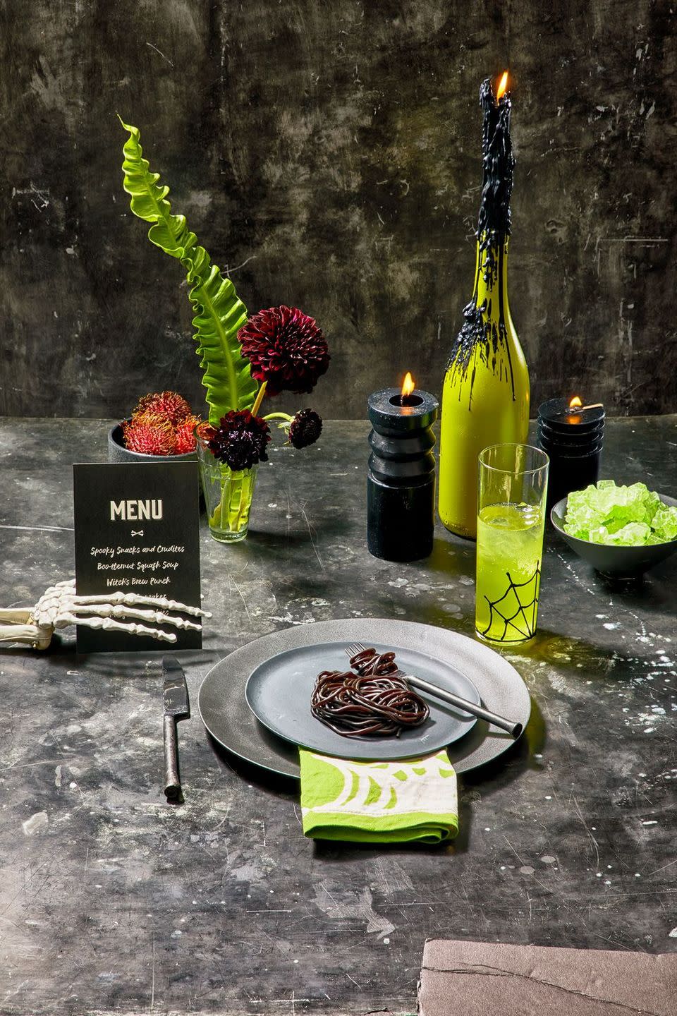 <p>Go the ghoulish route with a table setting and include black and green accessories, like candles, as well as dark and dramatic floral arrangements.<br></p><p><a class="link " href="https://go.redirectingat.com?id=74968X1596630&url=https%3A%2F%2Fwww.potterybarn.com%2Fproducts%2Fmason-modern-dinner-plate%2F&sref=https%3A%2F%2Fwww.goodhousekeeping.com%2Fholidays%2Fhalloween-ideas%2Fg33437890%2Fhalloween-table-decorations-centerpieces%2F" rel="nofollow noopener" target="_blank" data-ylk="slk:SHOP BLACK PLATES;elm:context_link;itc:0;sec:content-canvas">SHOP BLACK PLATES</a></p>