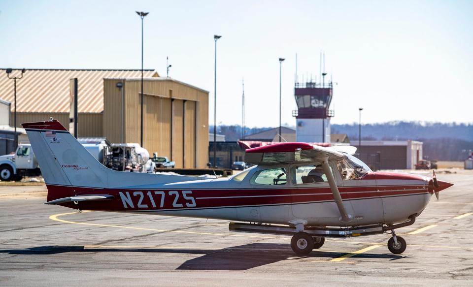 A pilot sits in his plane at Monroe County Airport on Tuesday, Feb. 20, 2024.