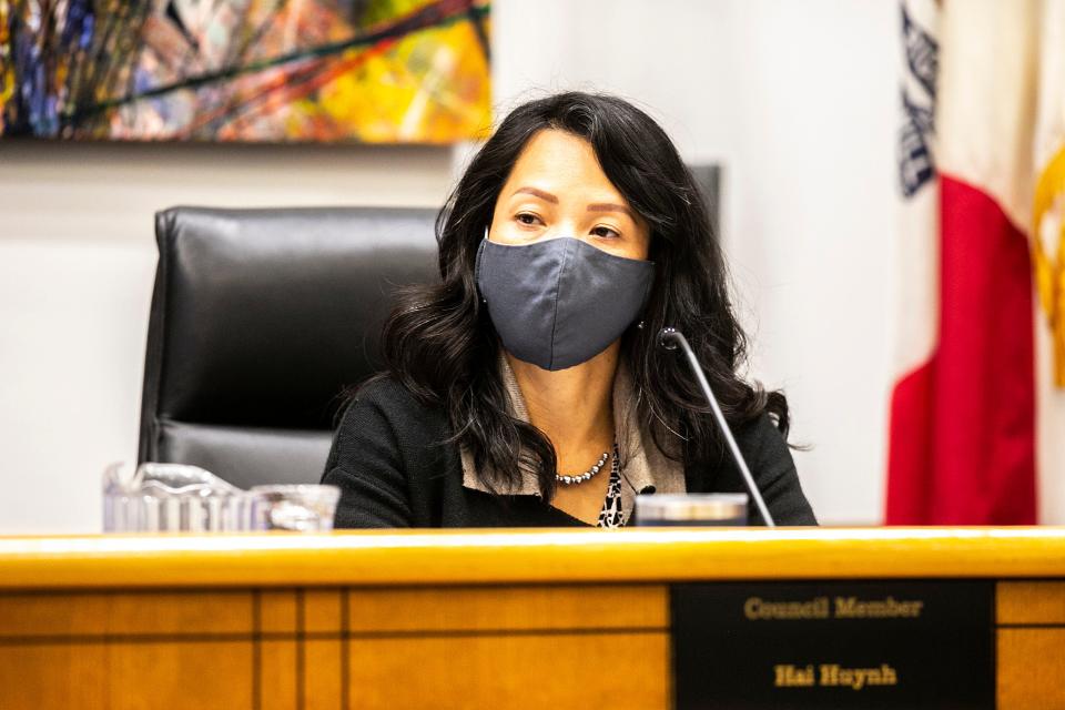 Coralville City Councilor Hai Huynh listens during a meeting, Tuesday, Oct. 26, 2021, at City Hall in Coralville, Iowa.