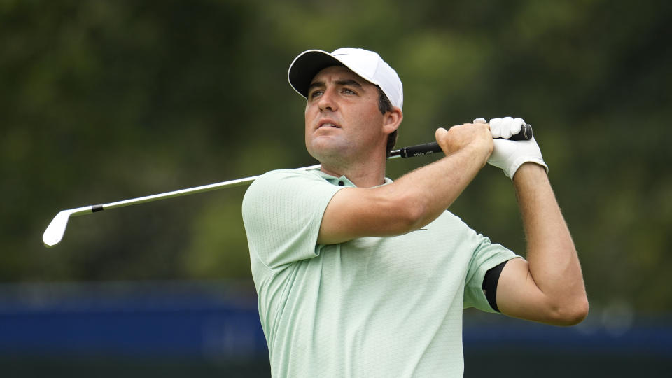 FILE - Scottie Scheffler watches his second shot from the 14th fairway during a practice round for the Tour Championship golf tournament at East Lake Golf Club Wednesday Aug 24, 2022, in Atlanta, Ga. (AP Photo/Steve Helber)