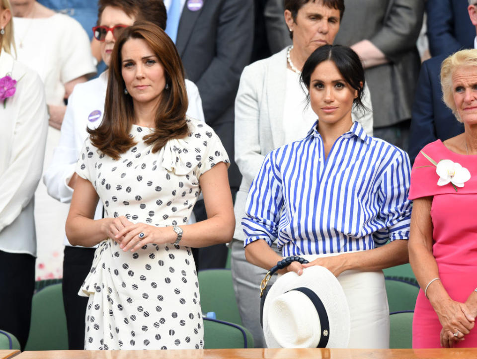 Catherine, Duchess of Cambridge and Meghan, Duchess of Sussex attend day twelve of the Wimbledon Tennis Championships at the All England Lawn Tennis and Croquet Club on July 14, 2018 in London, England.