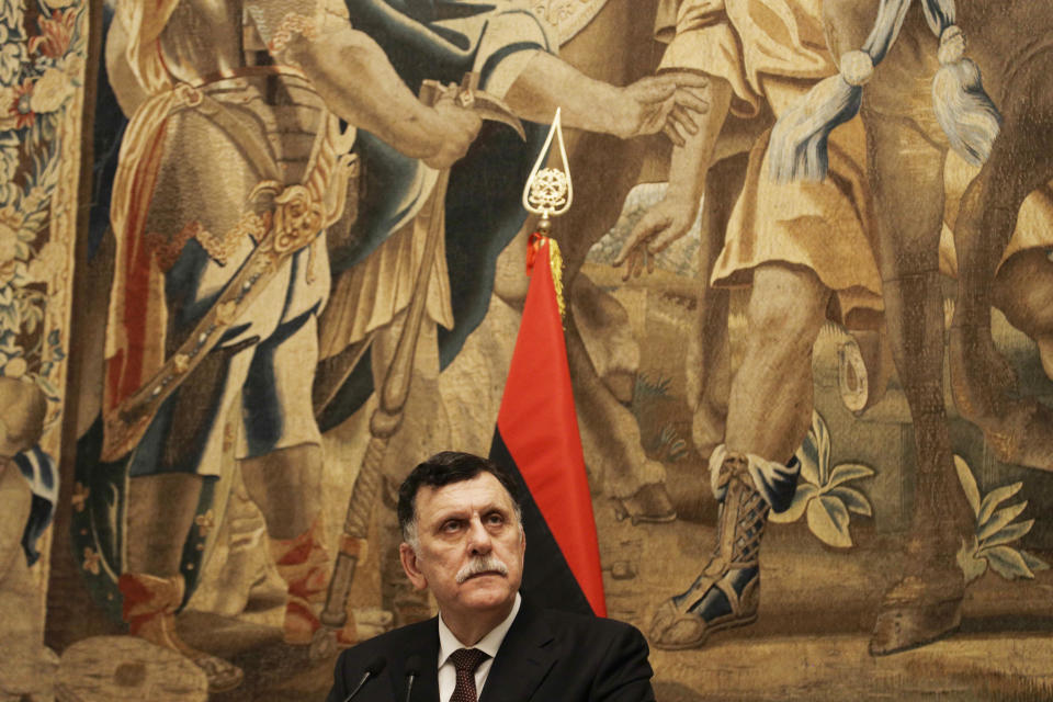 Libya's Prime Minister Fayez al-Sarraj holds a press conference after his meeting with Italian Premier Giuseppe Conte at Chigi palace, in Rome, Saturday, Jan. 11, 2020. (AP Photo/Gregorio Borgia)