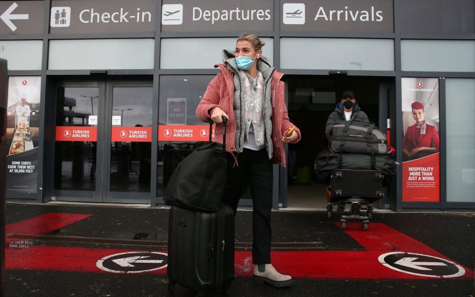 Passengers after arriving at Edinburgh airport  - Andrew Milligan /PA