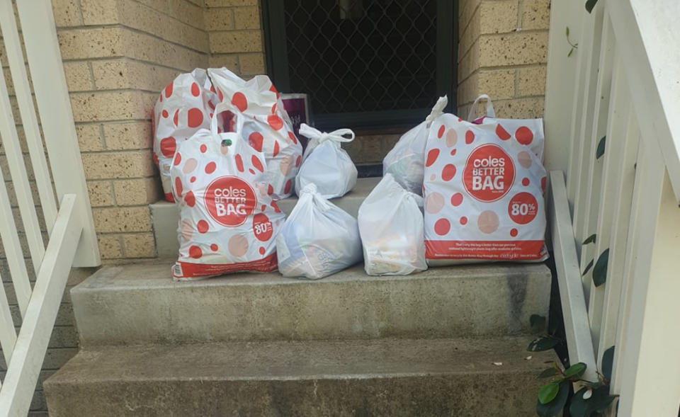 Groceries on a home's front steps after a family had their Coles order taken away.