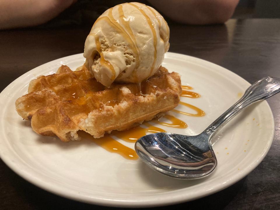 So warm. So cold. So sweet. This Belgian pearl sugar waffle is topped with smoked maple bourbon praline ice cream and caramel sauce.