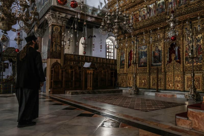 An interior view of the Church of the Nativity without any visitors after the Christmas celebrations were cancelled and the imposed closure on the city of Bethlehem due to continuous clashes between Israel and the Palestinian militant group Hamas. Faiz Abu Rmeleh/dpa