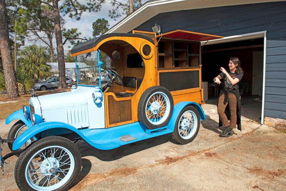 Jitterbug Beverage Co. co-owner Ari Booth sets up the company's mobile beverage delivery truck on a 1923 Ford Model T on Friday.