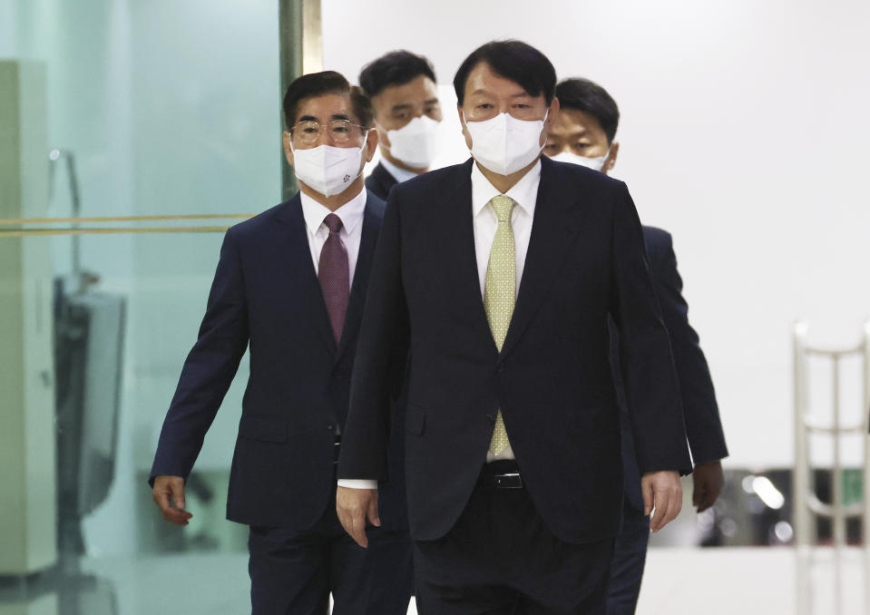 South Korean President Yoon Suk Yeol, front, arrives to attend the National Security Council (NSC) meeting at the presidential office in Seoul, South Korea, Wednesday, May 25, 2022. North Korea launched ballistic missiles toward the sea on Wednesday, its neighbors said, hours after President Joe Biden wrapped up his trip to Asia where he reaffirmed U.S. commitment to defend its allies in the face of the North's growing nuclear threat. (Ahn Jung-won/Yonhap via AP)